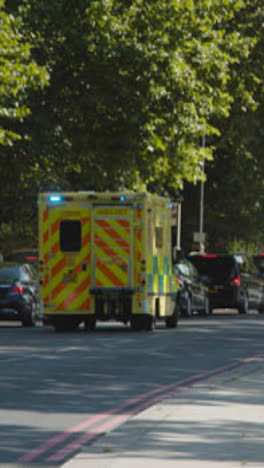 Vertical-Video-Emergency-Ambulance-Flashing-Lights-Driving-Busy-City-Traffic